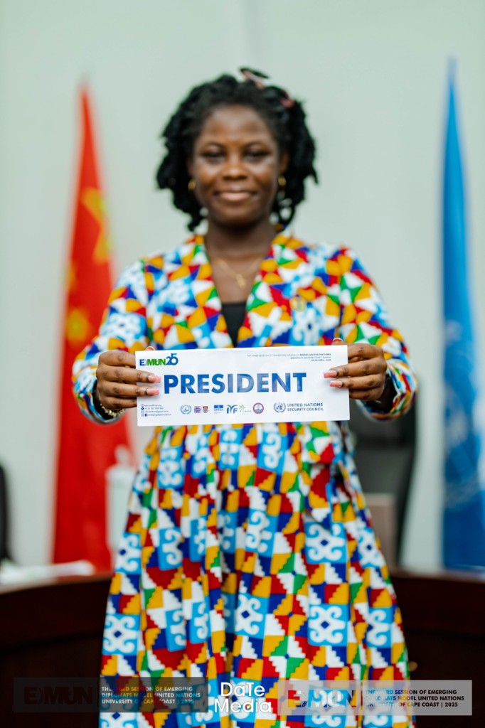 EDMUN president portrait with Security Council placard, University of Cape Coast 2025