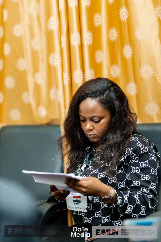 India delegate reading documents at EDMUN, University of Cape Coast 2023