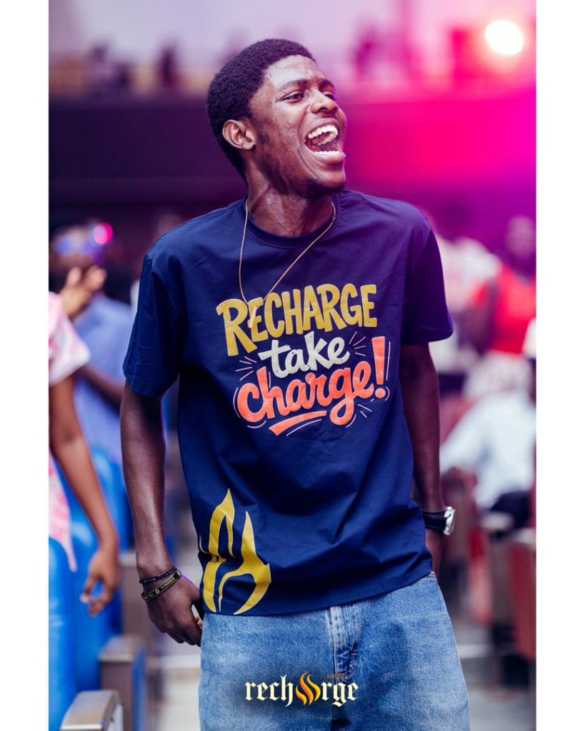 Young man at an event, smiling